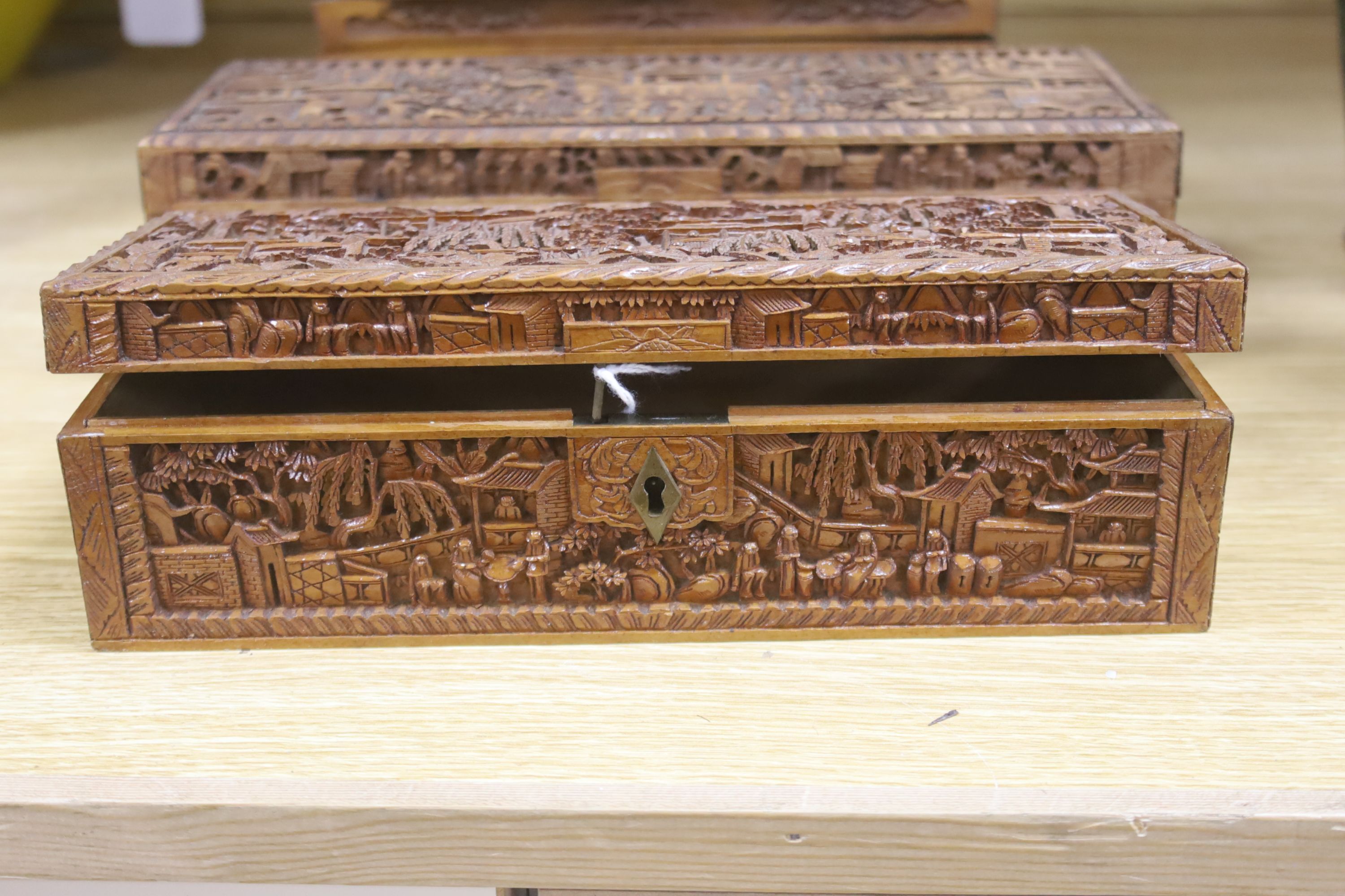 Three 19th century Chinese carved sandalwood boxes, 19th/20th century, longest 30cm